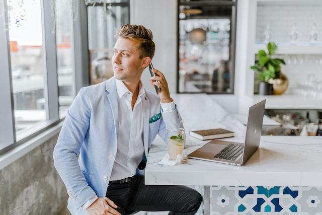 Person-in-a-blue-blazer-talking-on-the-phone